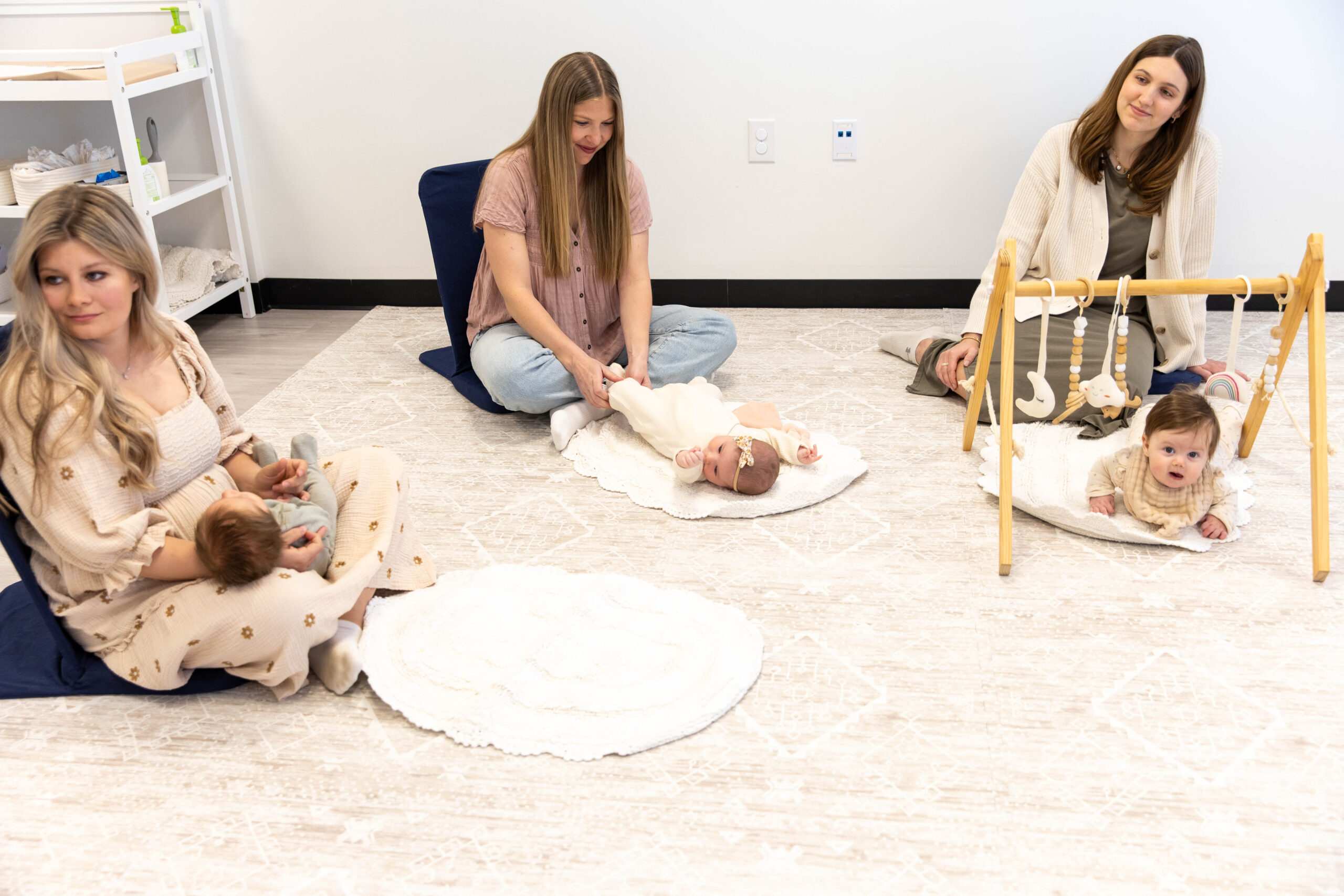 New moms receiving postpartum support at Hello Motherhood in Franklin, Tennessee, surrounded by a warm and welcoming environment.